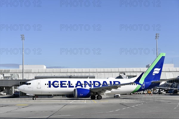 Iceland Air aircraft Boeing B737 MAX taxiing with Terminal 1