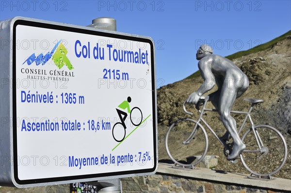 Statue for Tour de France cyclist Octave Lapize and sign telling angle of inclination for cyclists cycling the Col du Tourmalet in the Pyrenees