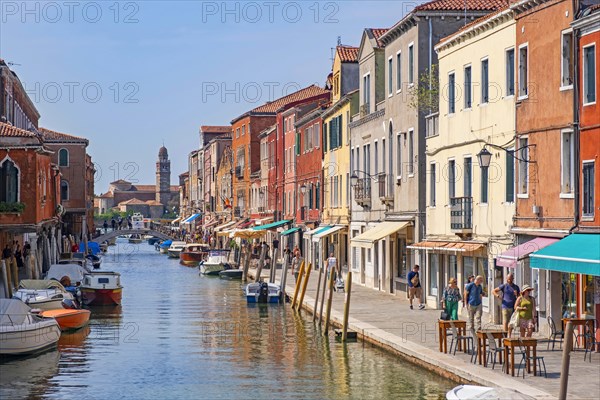 Tourists walk along the canal Rio dei Vetrai at Murano