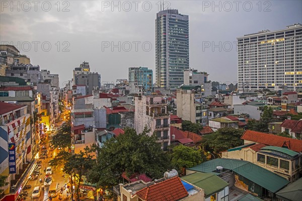 Aerial view over the busy city centre of Hanoi showing highrise buildings