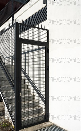 Exterior staircase blocked with fence
