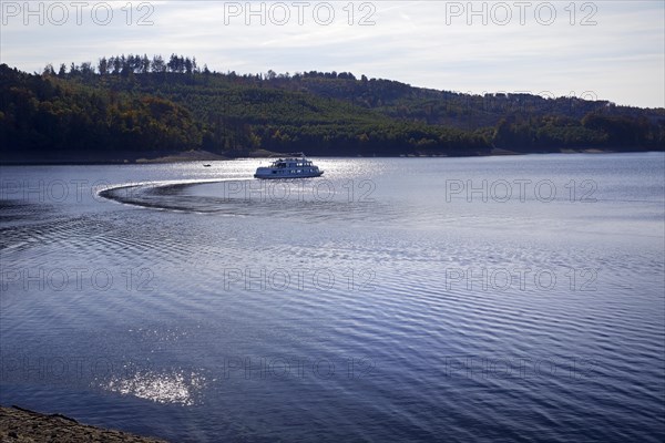 Sorpesee with the motor ship MS Sorpesee in the backlight