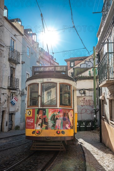 Old houses in narrow alleys and historic streets. Old house fronts in the morning and in the sunshine. the old town of alfama