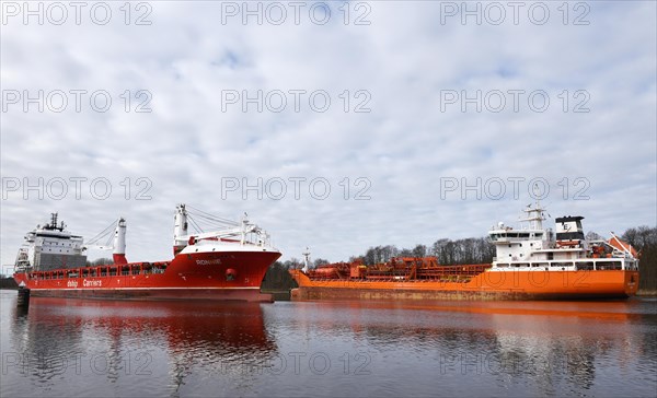 Cargo ship and tanker sailing through the Kiel Canal
