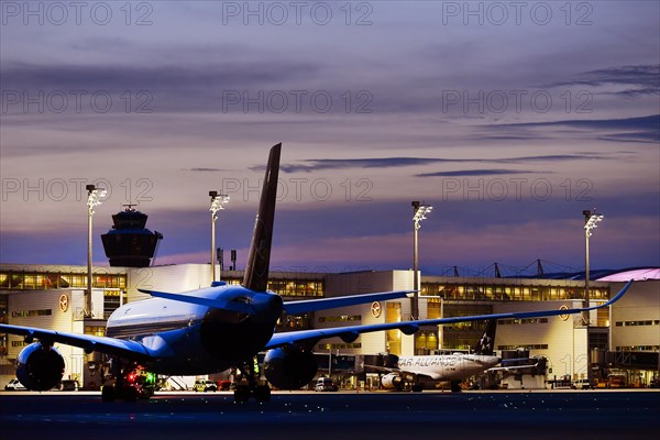 Lufthansa Airbus A350-900 New Livery being towed to position to Terminal 2 by tow truck at dusk