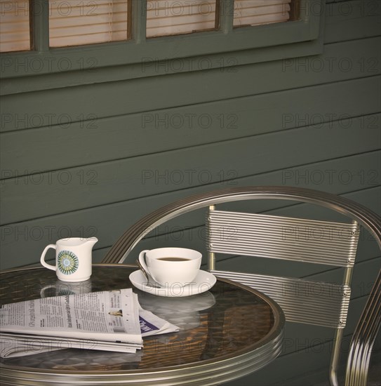 Cup of coffee and newspaper