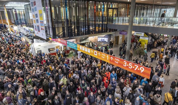 Entrance to the travel trade fair with many visitors