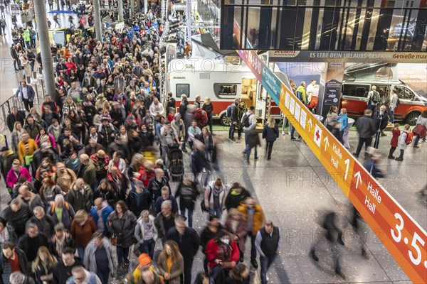 Entrance to the travel trade fair with many visitors