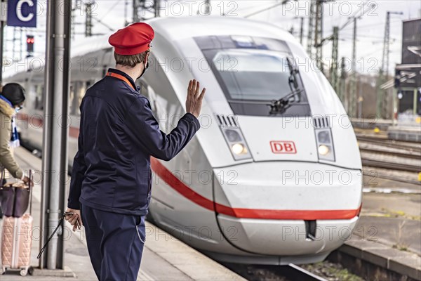 Arriving InterCityExpress ICE with uniformed Deutsche Bahn employee