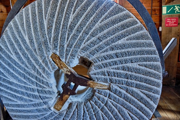 Millstone on display in the historic Sanssouci windmill