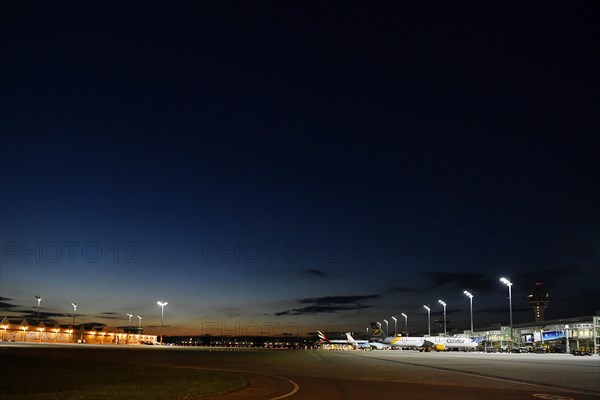 Apron West with Terminal 1 at night with tower and Condor and TUI fly