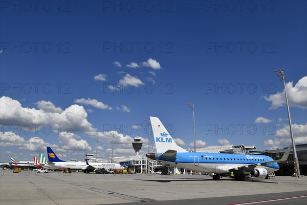 Aircraft parking on position at Terminal 1 with tower