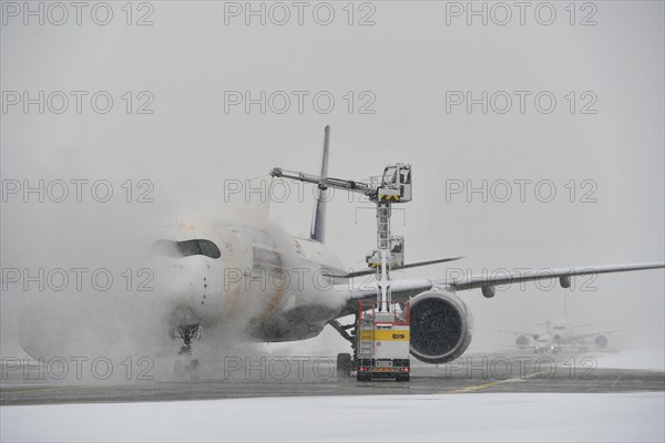 Aircraft de-icing in winter in front of take-off