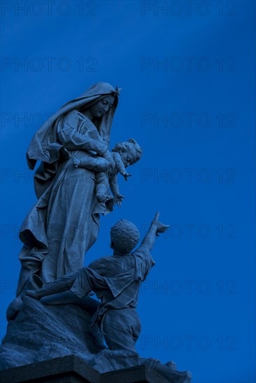 The statue Notre-Dame des naufrages at the Pointe du Raz at night