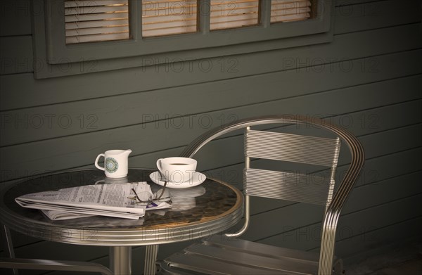 Cup of coffee and newspaper