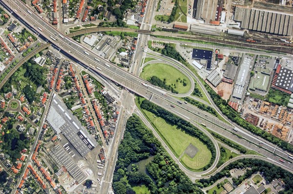 Aerial view over ribbon building and highway interchange