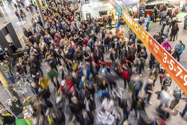 Entrance to the travel trade fair with many visitors