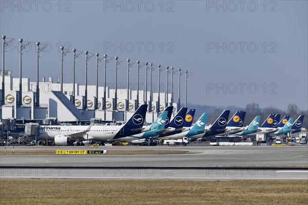 Lufthansa and Air Dolomiti aircraft parked in position at Terminal 2