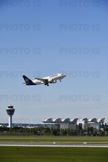 Taking off Lufthansa Airbus A319-112 on runway south with tower