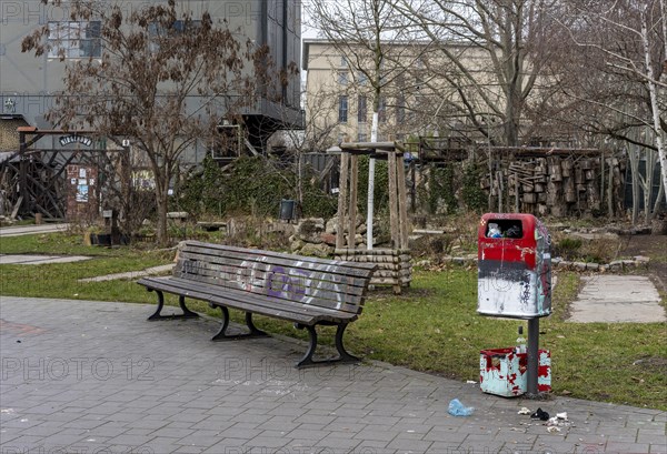 Soiled wastepaper bin in the park