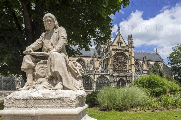 Statue of painter Nicolas Poussin and Collegiale Notre-Dame des Andelys