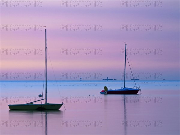 Two sailing boats on the North Sea in the evening light