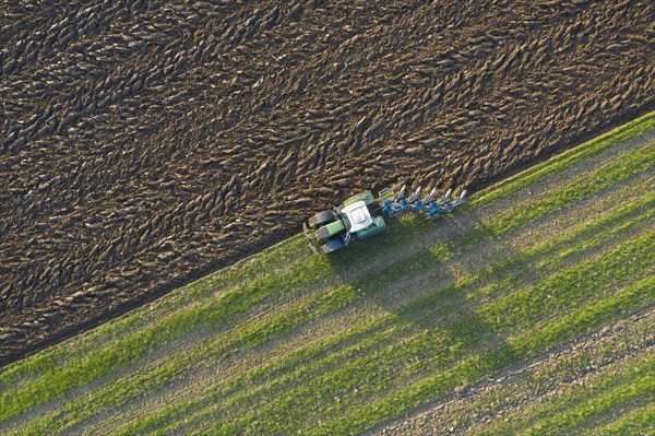 Tractor with plough