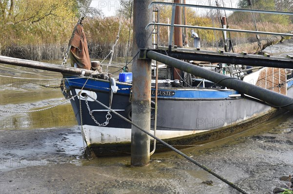 Ship stuck in the mud at low tide in Wischhafen