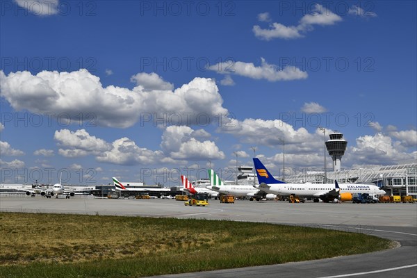 Aircraft parking on position at Terminal 1 with tower