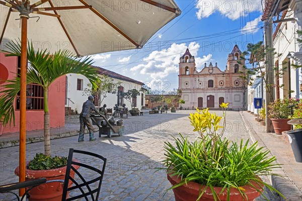 Camagueeyanos sculptures on the Plaza del Carmen and Iglesia de Nuestra Senora del Carmen in the old town centre of the city Camagueey on Cuba