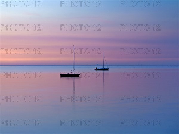 Two sailing boats on the North Sea in the evening light