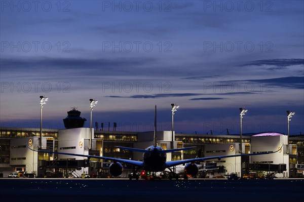 Lufthansa Airbus A350-900 New Livery being towed to position to Terminal 2 by tow truck at dusk