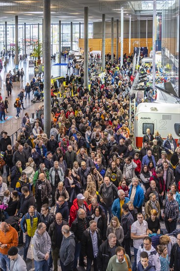 Entrance to the travel trade fair with many visitors