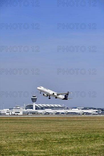 Taking off Lufthansa Airbus A320-200 on runway south with tower