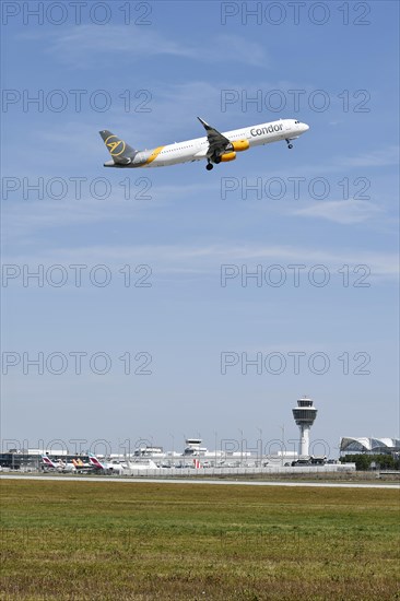 Condor Airbus A321 taking off on runway south with tower