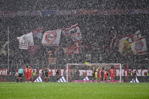 Bundesliga football match during driving snow