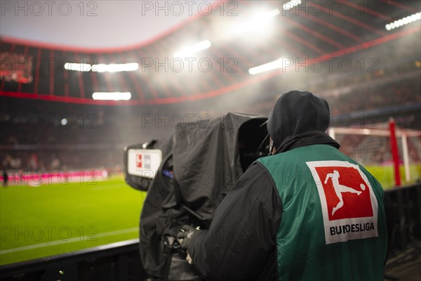 Cameraman with logo Bundesliga on TV camera