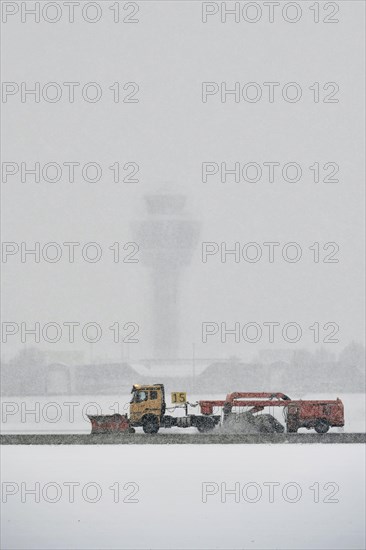 Sweepers clear snow on the southern runway