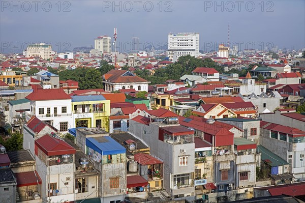 Aerial view over colourful houses and flats of the city Ninh Binh in the Red River Delta of northern Vietnam