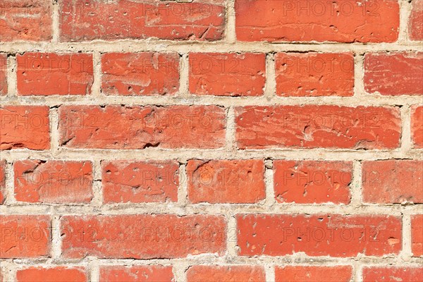 Background with old red stone brick wall