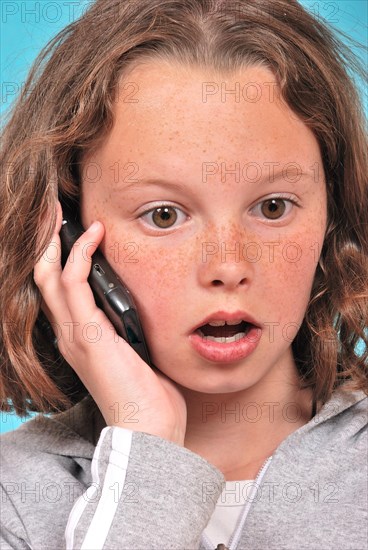 Portrait of teenager phoning