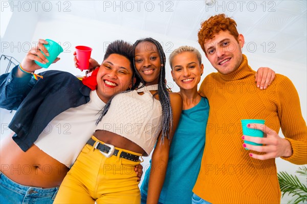 LGBT pride, lgbt rainbow flag, portrait of group of friends dancing in a house at party