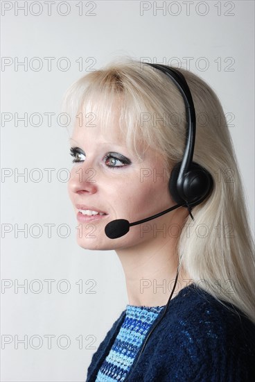 Portrait of young woman with headset