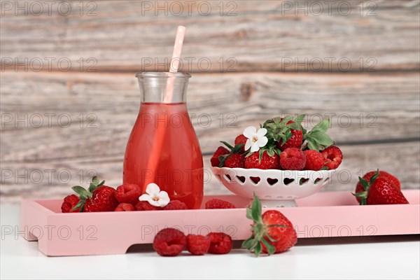 Homemade strawberry and raspberry fruit lemonade in jar