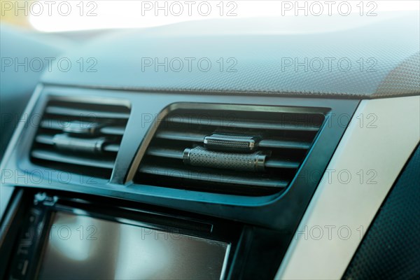 Close up of a car air conditioning panel. Air ventilation system of a car. Vehicle air conditioning window concept