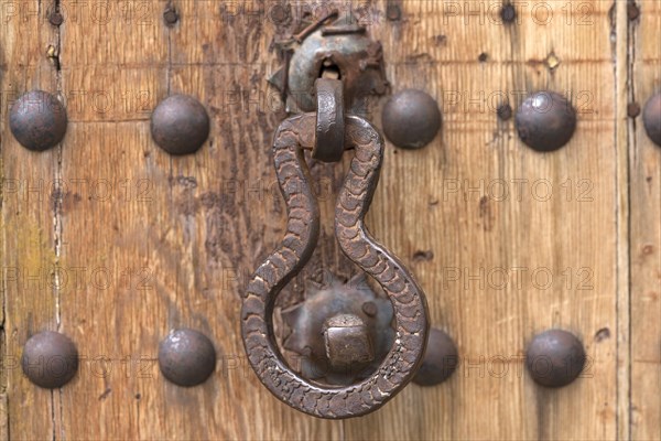 Old door knocker on a workshop door, Bavaria, Germany, Europe