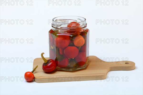 Jarred cherry peppers in vinegar, chilli, paprika