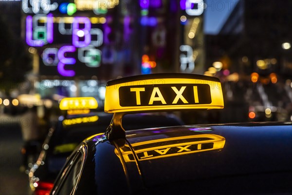 Taxi stand with taxi in the city centre at night, symbol photo, Stuttgart, Baden-Wuerttemberg, Germany, Europe