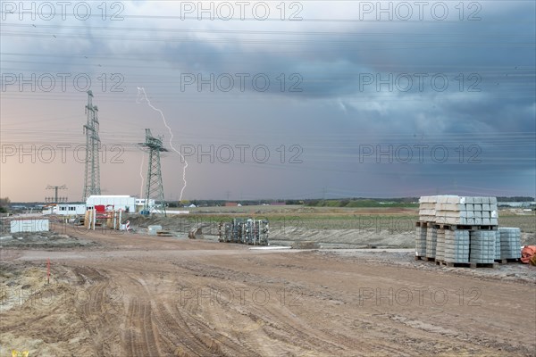 Thunderstorm cell with lightning, power pylons at Wolmirstedt substation, starting point for the southeast link, Wolmirstedt, Saxony-Anhalt, Germany, Europe