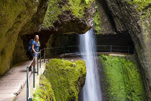 Hiker at Levada do Moinho, Waterfall in a gorge, Ponta do Sol, Madeira, Portugal, Europe